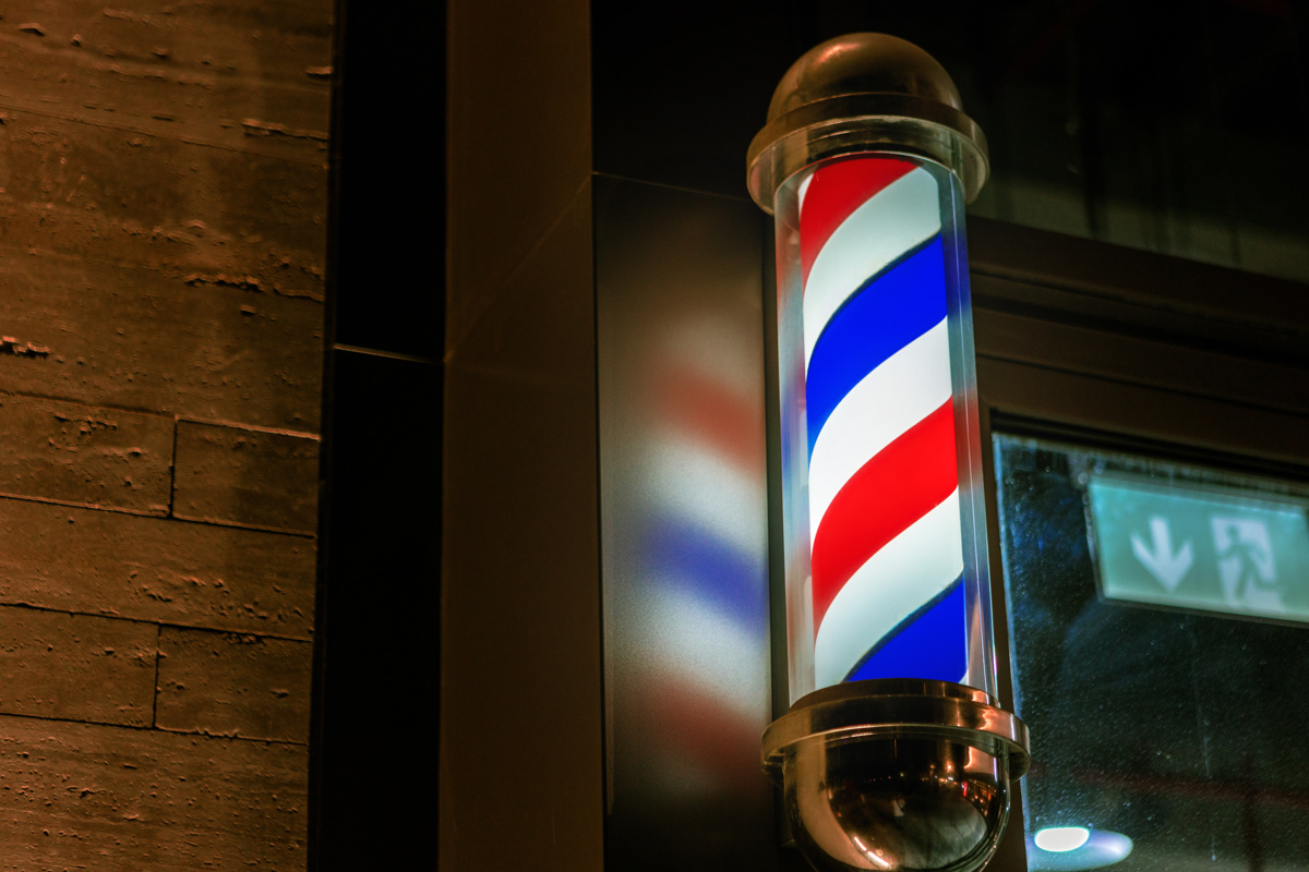 Barbershop Pole Sign Attached To A Wall Of Buildin 2025 02 25 22 05 36 Utc